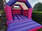 Pink and Purple bouncy castle in Didsbury for Hire