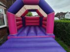 Hire Pink and Purple bouncy castle in Didsbury