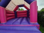 Hire Pink and Purple bouncy castle