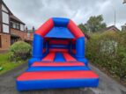 red and blue inflatable castle