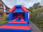 two-tone red and blue bounce castle