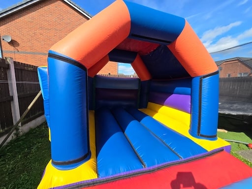 Multi colour jump castle for hire